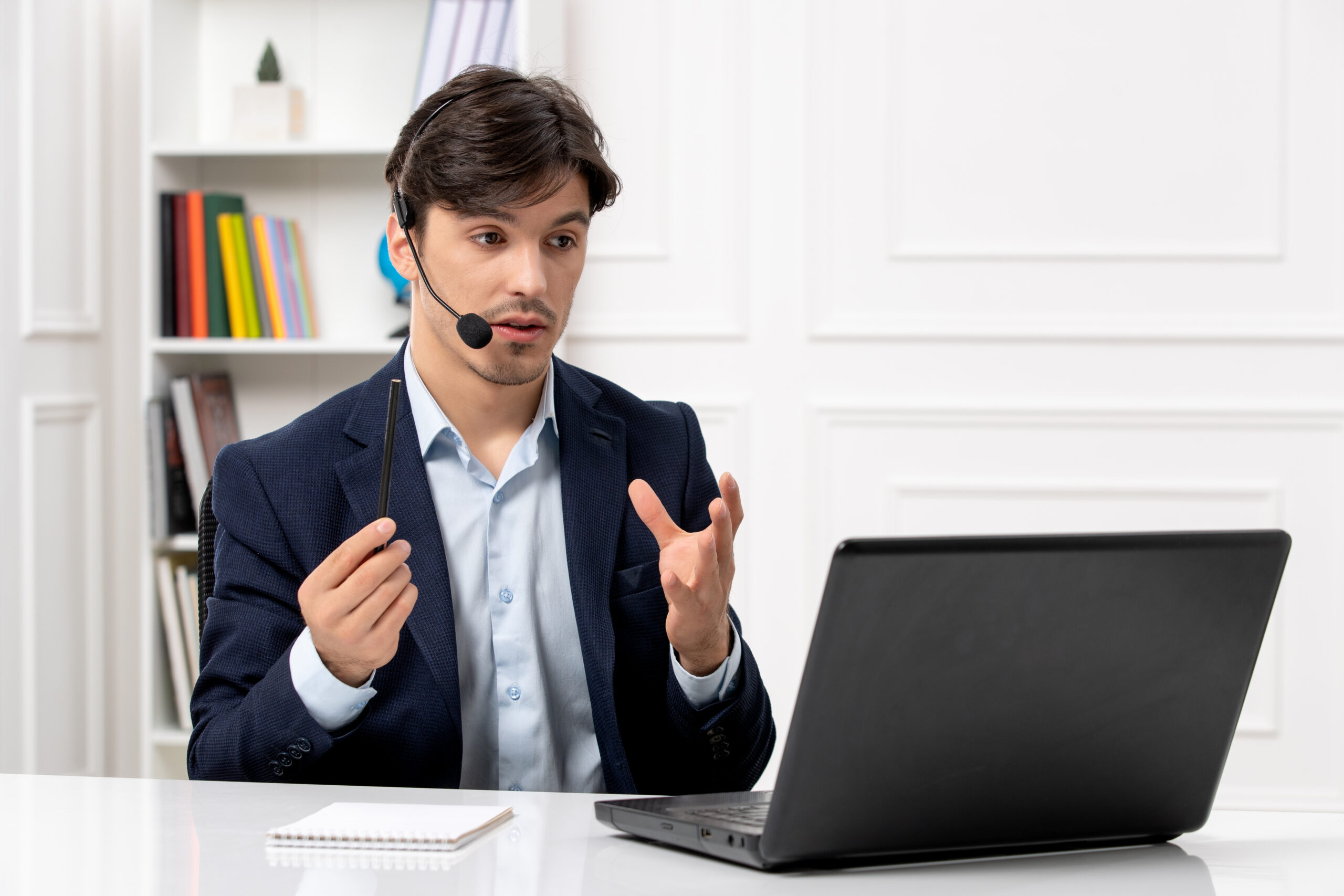 customer-service-handsome-guy-with-headset-laptop-suit-talking-videocall-computer